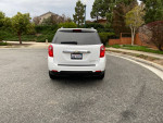 2011 Chevrolet Equinox LT parked on a residential street, showcasing its clean exterior and sleek design.