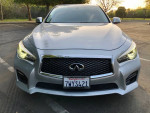 Front view of a 2015 Infiniti Q50 Sport in Liquid Platinum with a sleek design and premium styling.