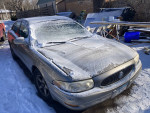 2000 Buick LeSabre in snowy condition, selling for $575, needs brakes, new tires, and battery.