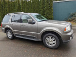 2004 Lincoln Aviator SUV in gray, featuring a clean exterior, leather interior, and third-row seating.
