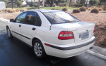 2001 Volvo S40 luxury sedan in polar white, showcasing its sleek design and well-kept condition on a sunny day.