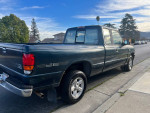 1997 Mazda B4000 SE pickup truck parked on a city street with a clear sky in the background
