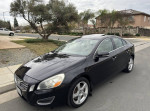2012 Volvo S60 T5 in black, featuring leather interior, sunroof, and Bluetooth connectivity.