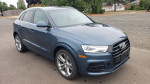 2017 Audi Q3 Quattro SUV in blue with leather interior and sunroof, parked on a road.