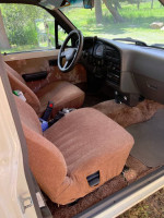 Interior of a 1990 Toyota Sunrader Motorhome showing seats and dashboard