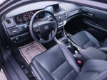 Interior view of a 2014 Honda Accord EX FWD showing black leather seats and manual transmission.