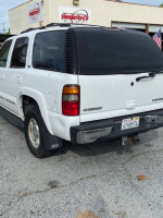 2003 Chevrolet Tahoe rear view, fully loaded LT model with 3-row seating and tow package for sale.