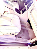 Interior view of a 2005 Chevrolet Tahoe LS featuring leather seats and WeatherTech floor mats.