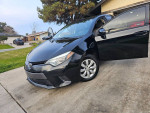 2015 Toyota Corolla LE FWD in black with 90,000 miles, featuring backup camera and Bluetooth.