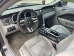 Interior view of a 2008 Ford Mustang with gray upholstery and steering wheel.