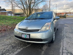 2009 Toyota Prius in silver color, showcased with a clean and detailed exterior, parked on a street