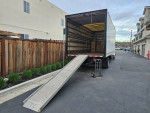 GMC C550 truck with ramp parked in Castro Valley, ready for sale in excellent condition.