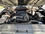 2009 GMC Yukon engine compartment showcasing well-maintained components and clean title, ideal family SUV.