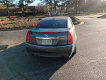 2009 Cadillac CTS in fair condition, rear view showing design and details on a sunny day.