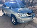2008 Lexus RX 350 in excellent condition, featuring light tan leather seats and V6 engine, parked outdoors.