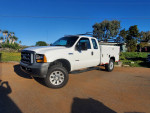 2006 Ford F250 4x4 Utility truck with custom rims and new tires, well maintained, ready for work.