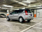 2012 Hyundai Elantra Touring in a parking garage, showcasing a silver hatchback design with roof racks.