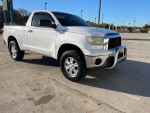 2007 Toyota Tundra SR5 4WD with oversized tires and stainless brush guard parked