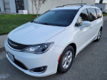 2017 Chrysler Pacifica Touring-L Plus van parked, clean white exterior, spacious interior for 8 passengers.