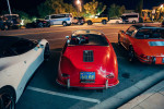 Red Porsche 365 Speedster replica parked at night, showcasing classic design and chrome accents in Santa Barbara.