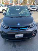 Front view of a 2014 BMW i3 with Range Extender, Terra package, parked in a parking lot.