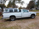 82 GMC S-15 Sierra Classic Pickup Truck parked on gravel, showcasing its great condition and classic design.